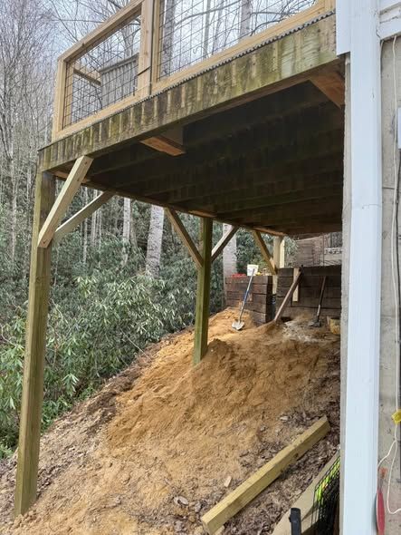 Deck supports after repair on a steep hillside
