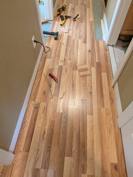 Flooring install in progress down a hallway
