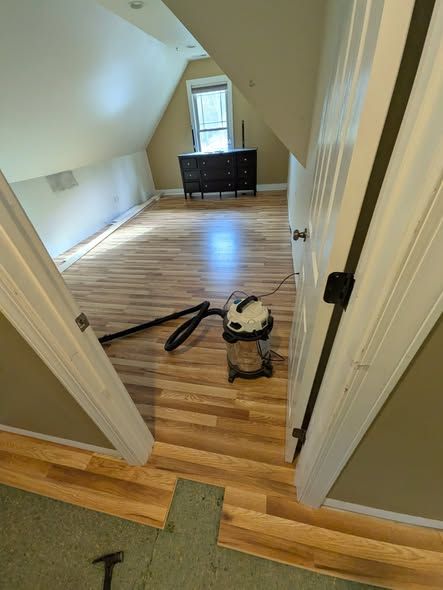 Same doorway with new wood flooring installed