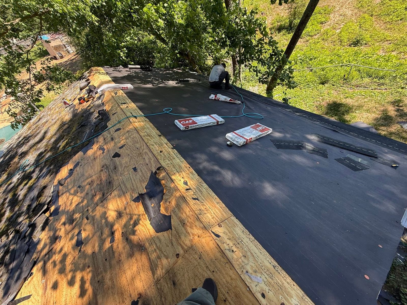 Roof tear-off with new underlayment going down
