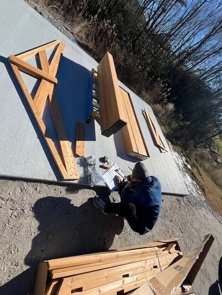 Cutting and laying out timber posts for a pavilion